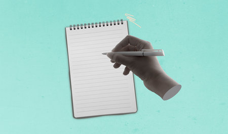 Human hand with pen write on paper on green background, conceptual image. Mockup with empty copy...