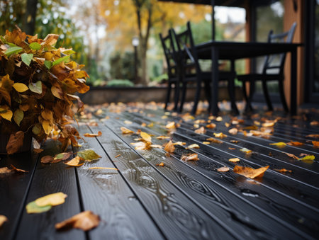 Autumn leaves on a wooden floor in a cafe. Autumn backgroundの素材