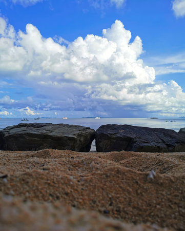 Beautiful seascape with rocks and blue sky. Nature composition.の写真素材