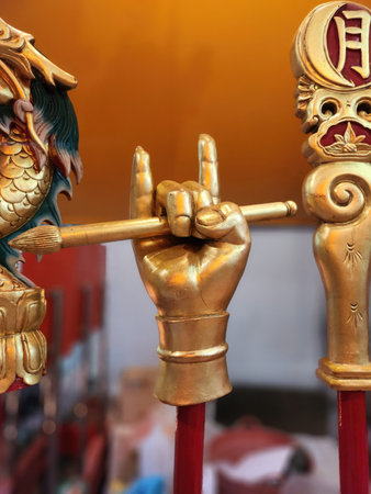 Hands of a golden dragon in the Chinese temple, closeup of photoの写真素材