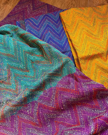 Colorful loincloth on a wooden floor. Close up.