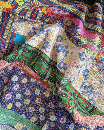 Texture, background, pattern. Women's shawl in the style of embroidery.