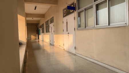 Sunlit Corridor in Modern Building with Minimalist Design Elementsの写真素材