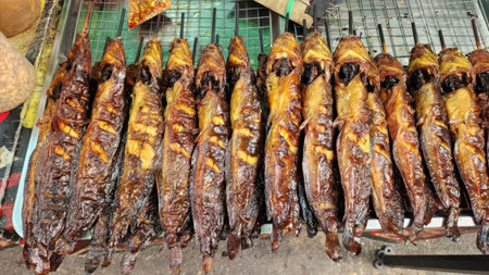 Traditional Thai Grilled Catfish Skewers at a Local Street Food Market Stall
