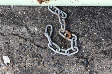 Old chain on concrete ground -Backgroundの写真素材
