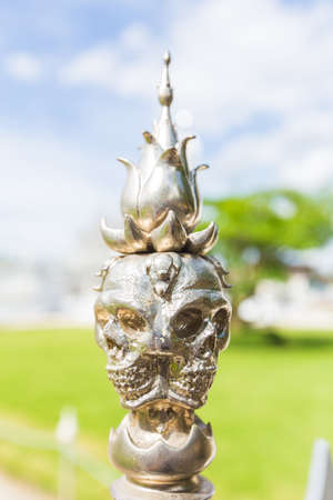 Shaped skull of pillar top in temple of Thailand. It's hell territory simulationの写真素材