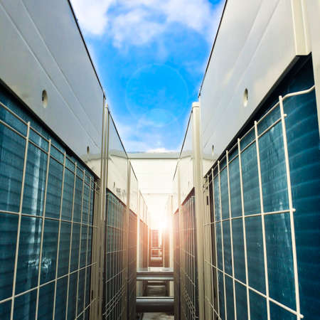 Condenser unit used in central air conditioning systems - heat exchanger (heat micro canel) section to cool down and condensate incoming refrigerant vapor into liquid. background  texture. Air conditioner technology.の写真素材