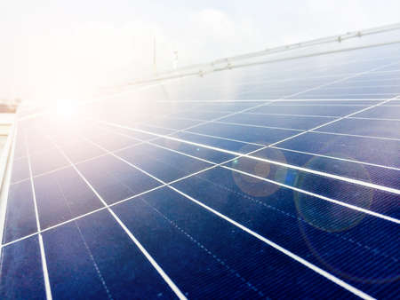 Soft focus of Solar panels or Solar cells on factory rooftop or terrace with sun light, Industry in...