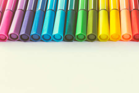 multicolored of magic colors (colours) for paint or draw on paper with copy space and vintage color effect on isolate background.の写真素材