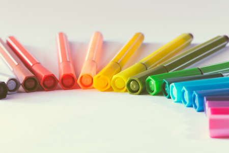 multicolored of magic colors (colours) for paint or draw on paper with copy space and vintage color effect on isolate background.の写真素材