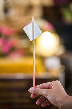 Gold leaf for put onto The Buddha statue to gild. Which people use to worship the buddha image. Selective focus.の写真素材