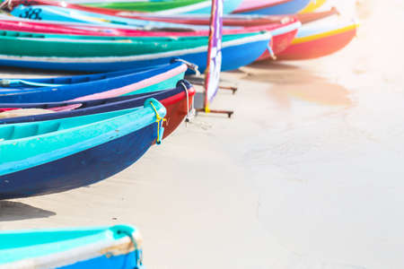 Multicolor rowboat or sea kayaks on beach with copy space. in holiday time.の写真素材