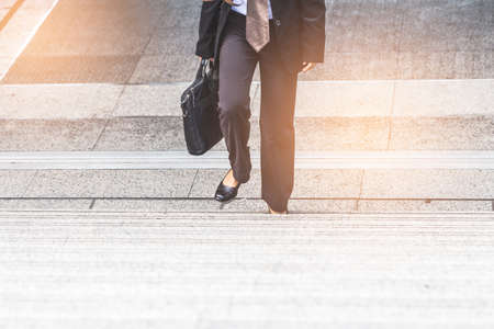 Business women the stairs in a rush hour to work.の写真素材