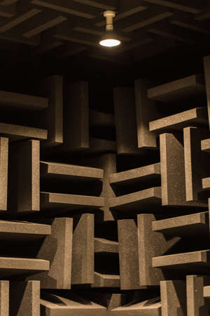 Background of studio sound dampening acoustical foam and LED light. Music romm. Soundproof romm. Low key photo.の写真素材