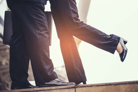 business woman Jump embracing her husband after finish working at city. Young couple worker. Young businessman in city.の写真素材