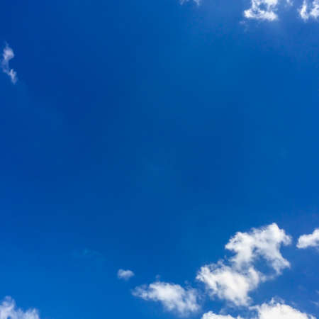 blue sky with fluffy clouds for blackground. Freedom concept.の写真素材