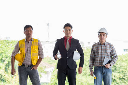 Portrait of confident labor and engineer standing with safety helmet on old buildings in his job...
