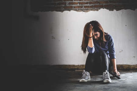 Sad women who are thinking about suicide committed by guns. Social problems concept.