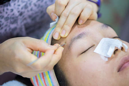 Beauty treatment of face skin for spot remover in SPA center. Acne treament.