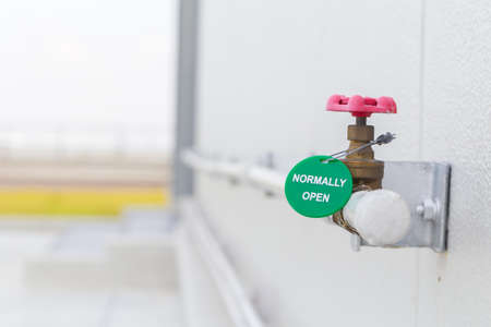 The water valve at the connection steel pipe steel wih normaly open label and water piping system....