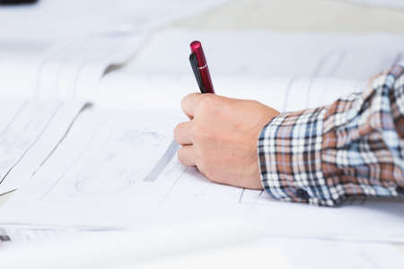 Management consulting with engineers working with blueprint and drawing on work table in for management business plan and construction site project.の写真素材