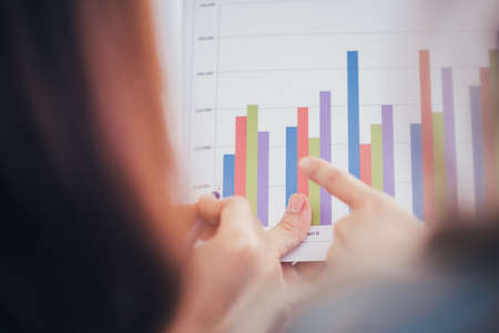 Businesswoman giving presentation to her partner about summary of production capacity.の写真素材