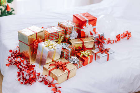 Christmas gift box and Christmas decoration with Christmas tree at back side. Copy space for your...