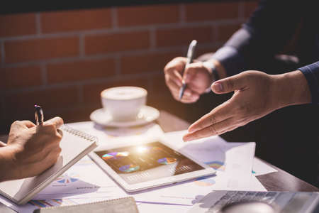 Hand of Businessman and businesswoman presenting their business projectの写真素材