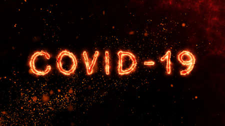 COVID-19 text animation with fire burn effect follow COVID-19 text with fire particles dark background. Covid-19 virus or Corona virus with fire burn concept.の写真素材