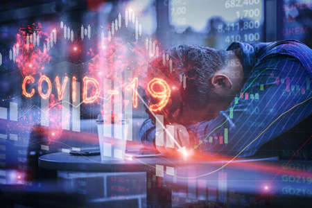 Stressed Businessman feeling down about investment in stock market crash caused by the Covid-19 or...