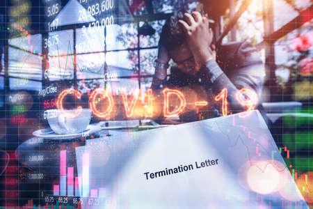 Stressed Businessman feeling down about investment in stock market crash caused by the Covid-19 or Coronavirus, financial crisis and economic crisis from Covid-19 or Coronavirusの写真素材