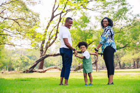 Happy African American family life concept. African American parents (Father, Mother) and little boy...