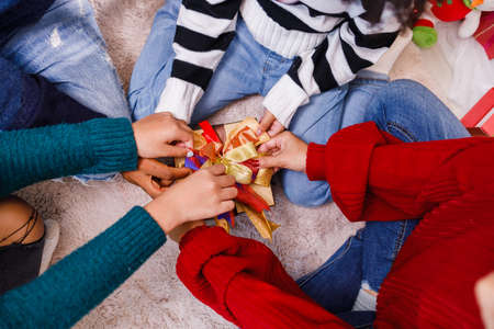 family help wrapping gift box, celebration holiday Christmasâs day. Modern lifestyle people love fun together with childhood conception. Merry Christmas.の写真素材