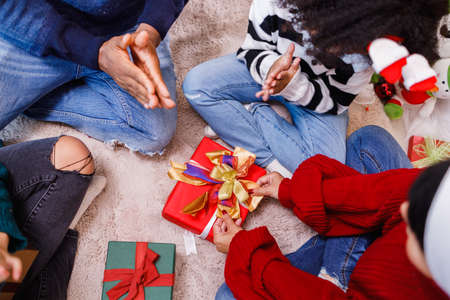 family help wrapping gift box, celebration holiday Christmasâs day. Modern lifestyle people love fun together with childhood conception. Merry Christmas.の写真素材