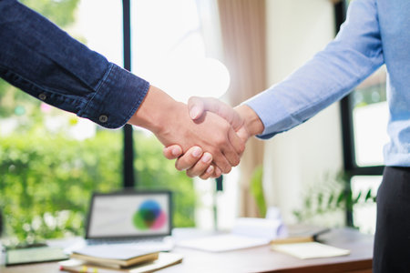 Close up handshake of business people in meeting attendance. Partners corporate relationship conceptの写真素材
