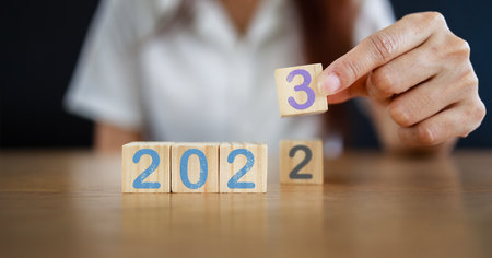 2023 New year concept. From 2022 to 2023 on wooden block.  Inspiration to success ideas and goal