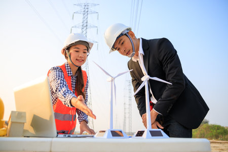 Outdoor meeting between engineers on construction siteの写真素材