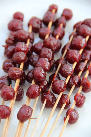 Candy small star gooseberry on a plateの写真素材