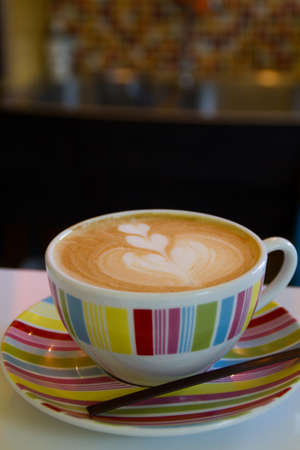 coffee latte art on the color cupの写真素材