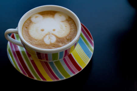 coffee latte art on the color cupの写真素材