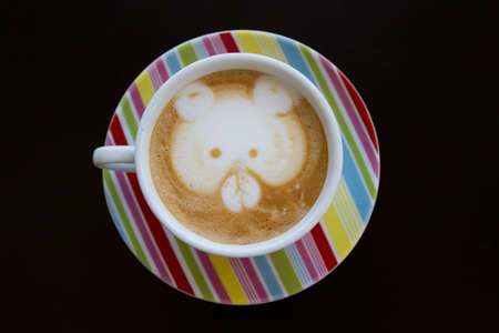coffee latte art on the color cupの写真素材