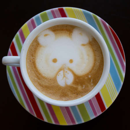 coffee latte art on the color cupの写真素材