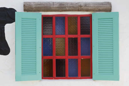 retro wood red windows on white wallの写真素材