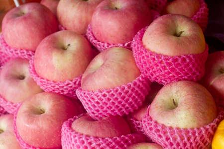 Lots of apples for sale on the marketの写真素材
