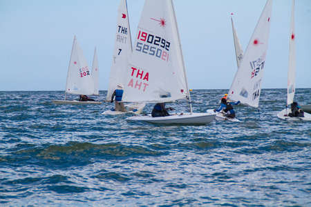 Unidentified sailing competitors in King' cups Hua Hin Regatta 2012 - Hua Hin Beach near Hyatt Hotel on August 11, 2012 in Hua Hin, Thailandのeditorial素材