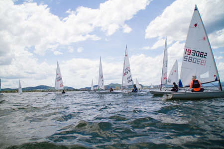 Unidentified sailing competitors in King' cups Hua Hin Regatta 2012 - Hua Hin Beach near Hyatt Hotel on August 11, 2012 in Hua Hin, Thailandのeditorial素材