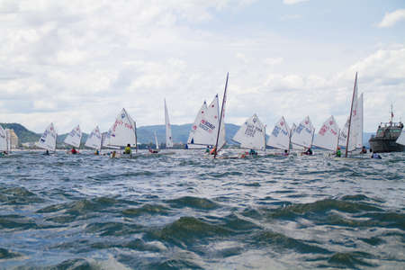 Unidentified sailing competitors in King' cups Hua Hin Regatta 2012 - Hua Hin Beach near Hyatt Hotel on August 11, 2012 in Hua Hin, Thailandのeditorial素材