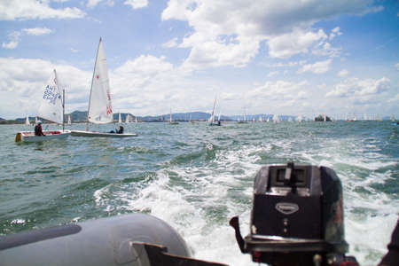 Unidentified sailing competitors in King' cups Hua Hin Regatta 2012 - Hua Hin Beach near Hyatt Hotel on August 11, 2012 in Hua Hin, Thailandのeditorial素材
