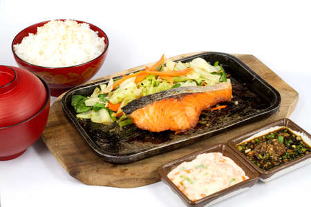 Japanese food style , salmon fish grilled the plate on white backgroundの写真素材