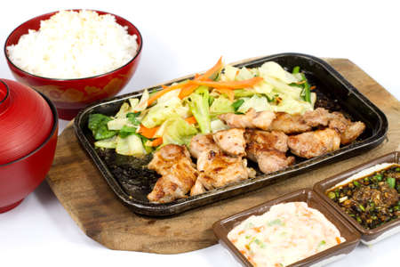 Japanese food style , pork grilled the plate on white backgroundの写真素材